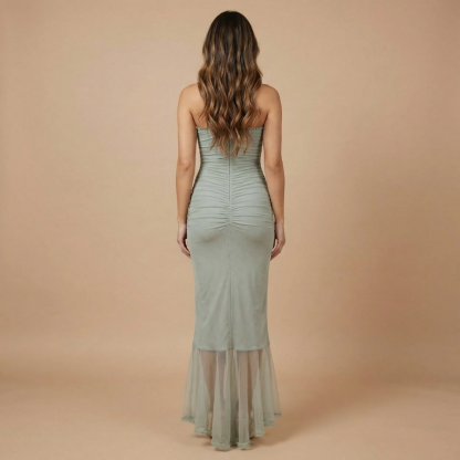 Back view of sage green ruched maxi dress showing sweetheart back and flowing ruffled hemline