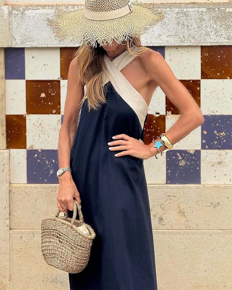 Navy sleeveless maxi dress with cream crossed halter straps detail