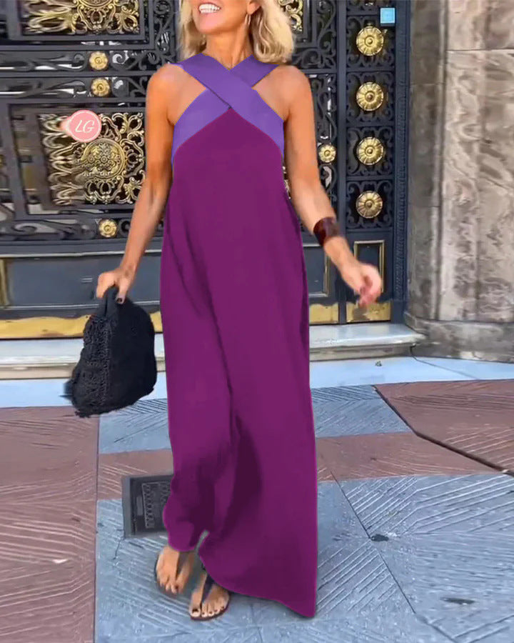 Magenta maxi dress with purple crossover neckline and flowing skirt