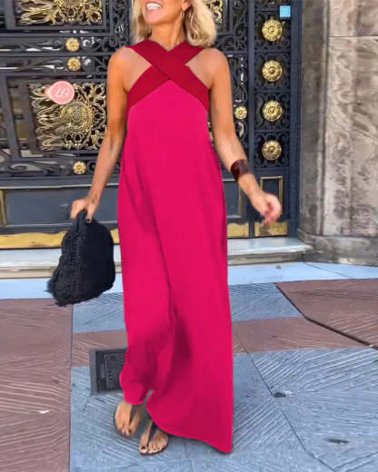 pink maxi dress with deep red crossover straps and asymmetrical train