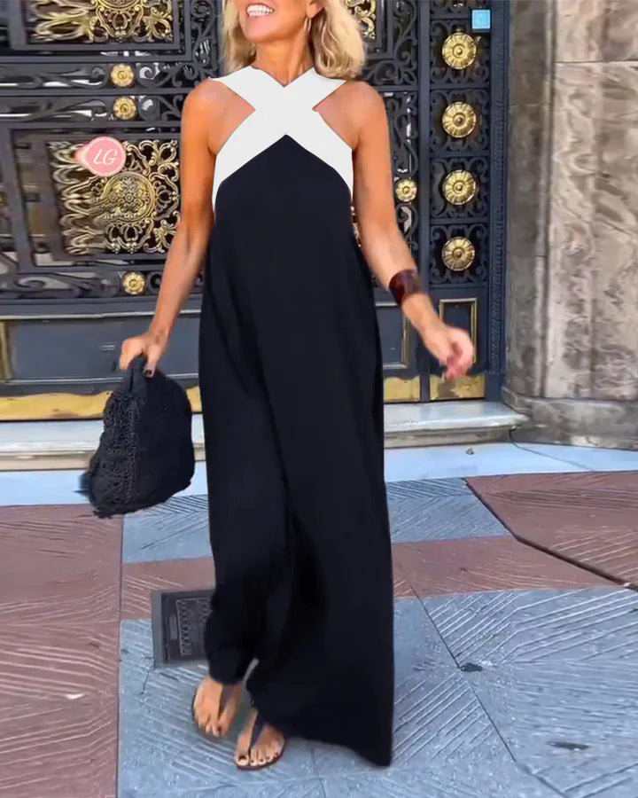 Black maxi dress with white crossover neckline and flowing skirt