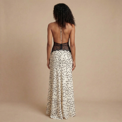 Back view of cream polka dot maxi dress with lace detail