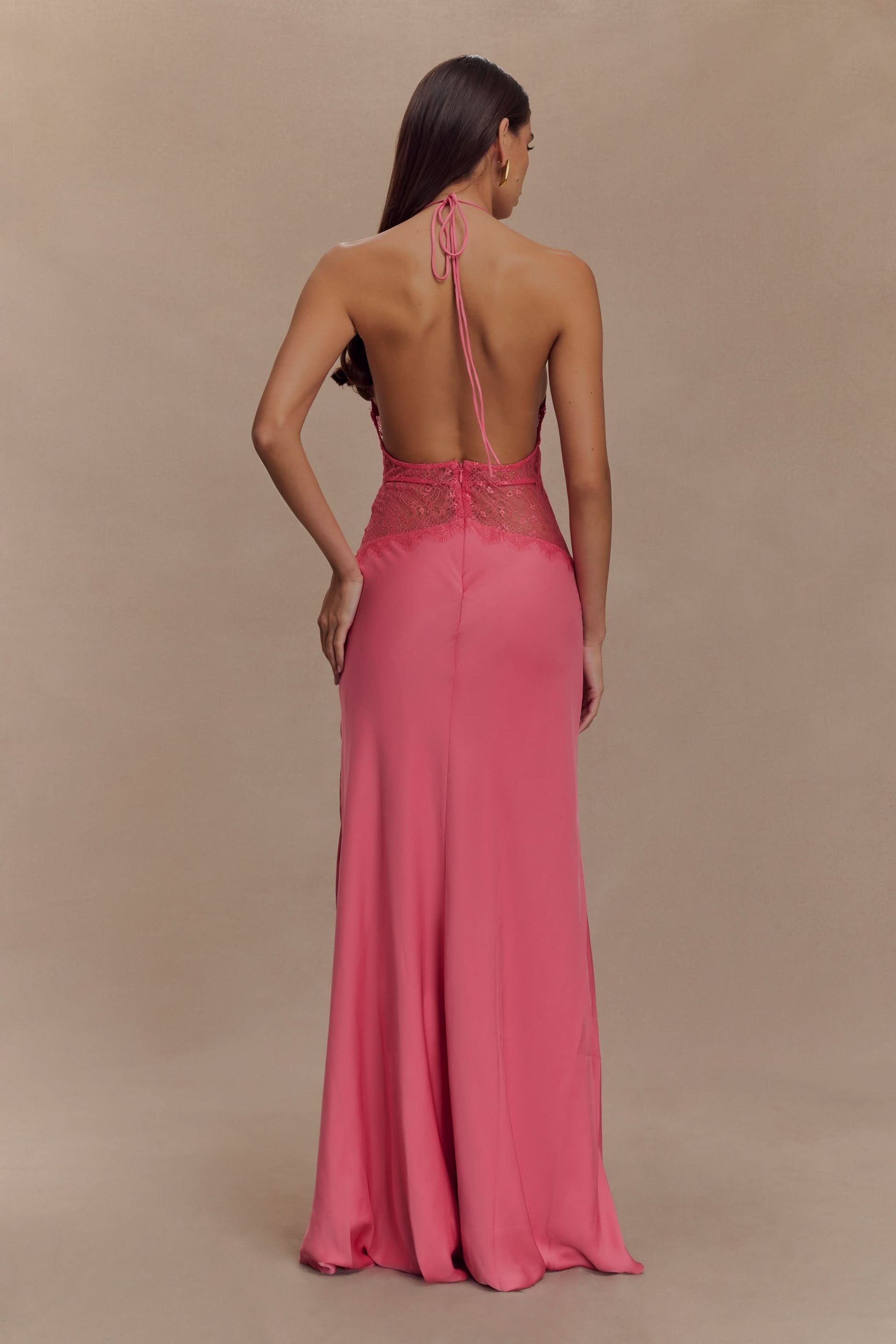 Back view of pink lace maxi dress with halter tie and flowing train