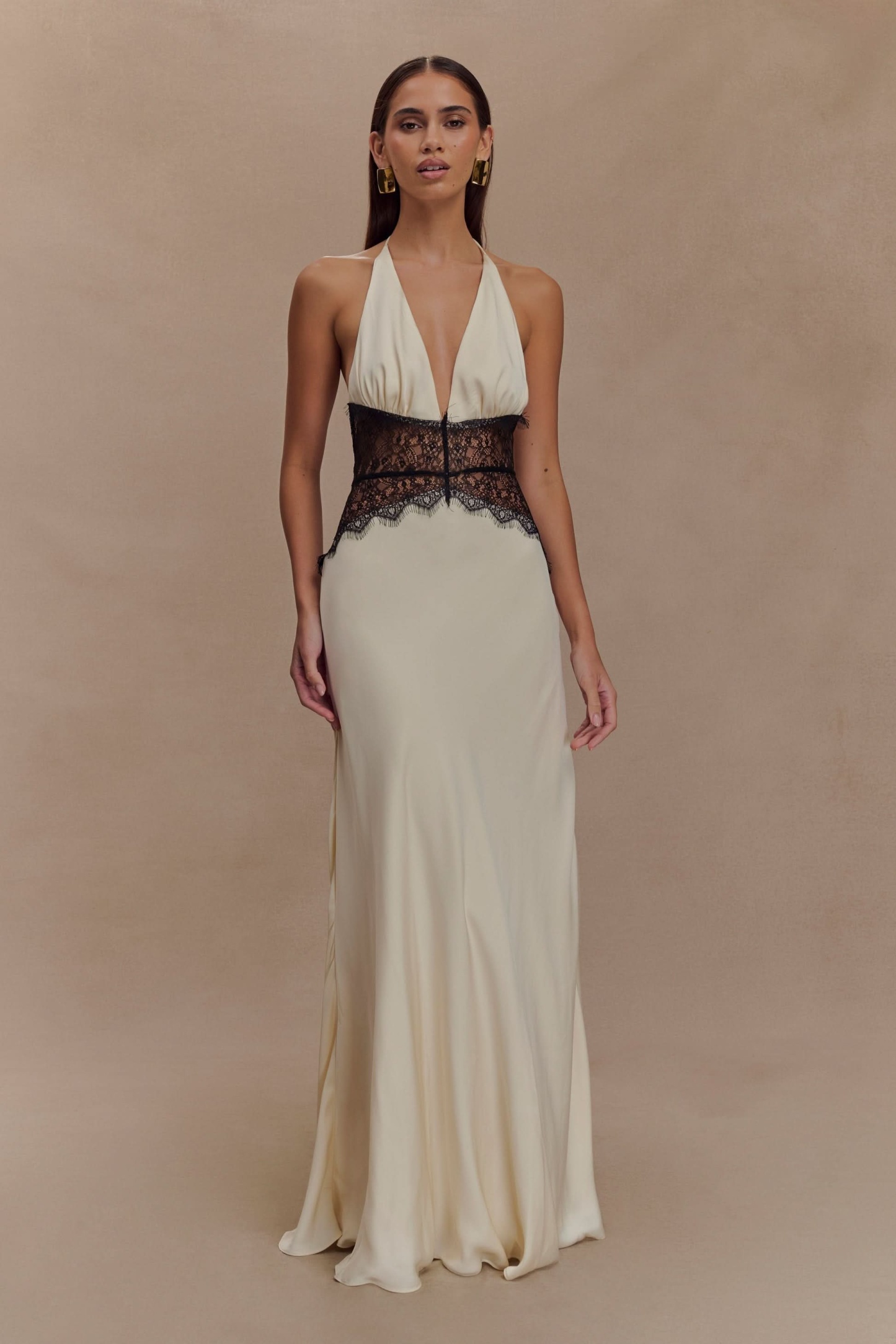 Cream halter maxi dress with black lace waist band and V-shaped neckline