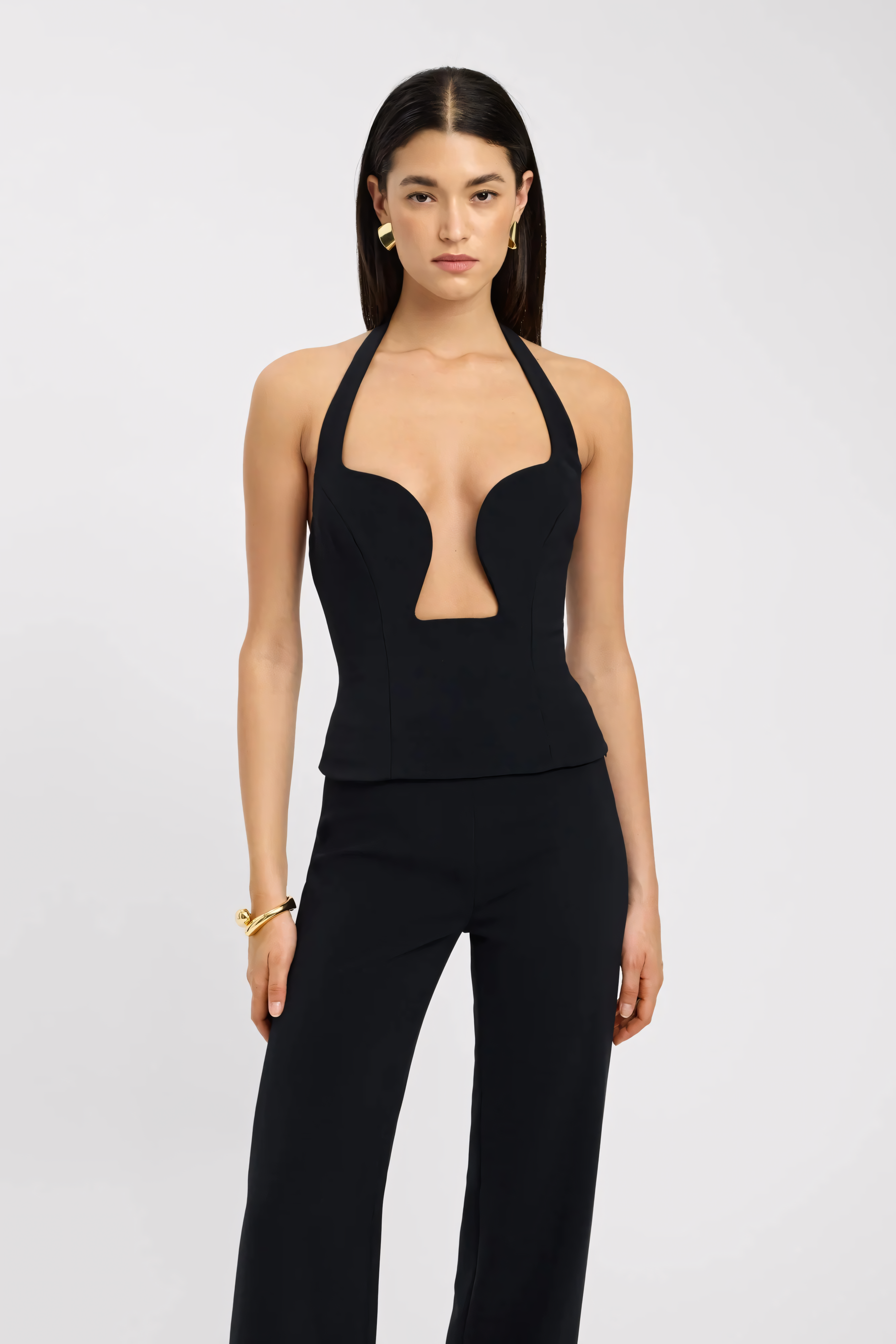 Black sweetheart bustier top with deep plunge cutout and halter neck closure detail for women