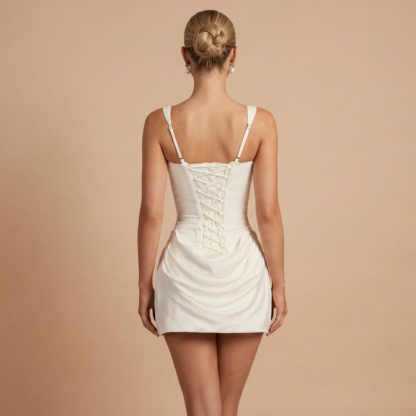 Back view of white corset dress showing lace-up corset back