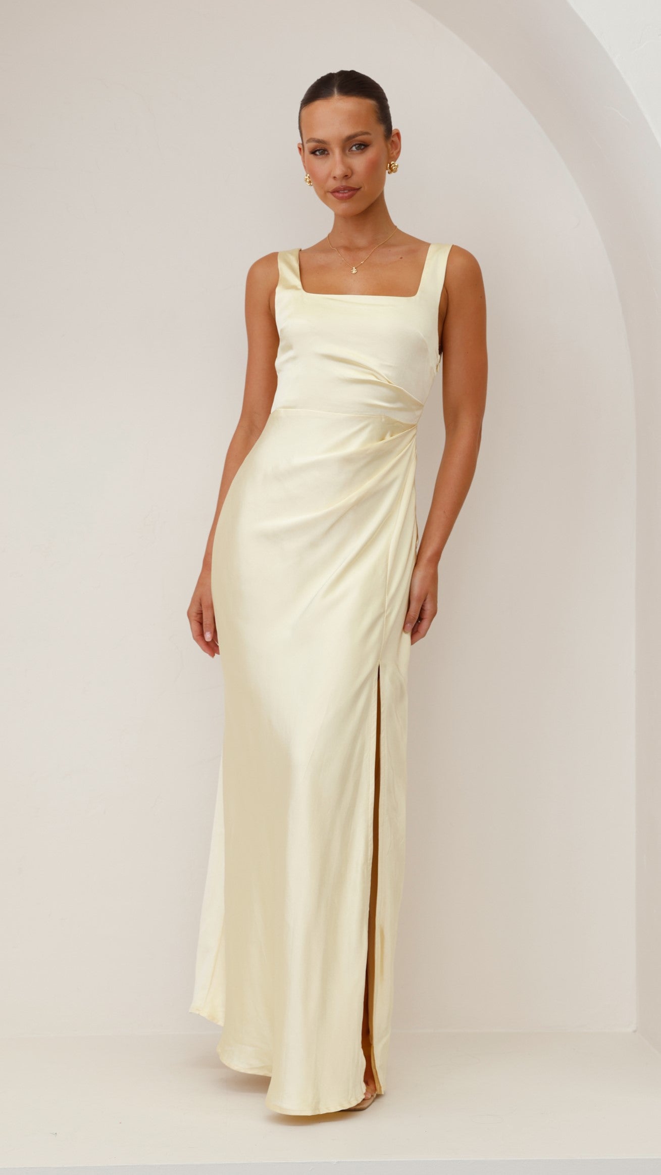 Cream sleeveless ruched maxi dress with square neckline and side slit