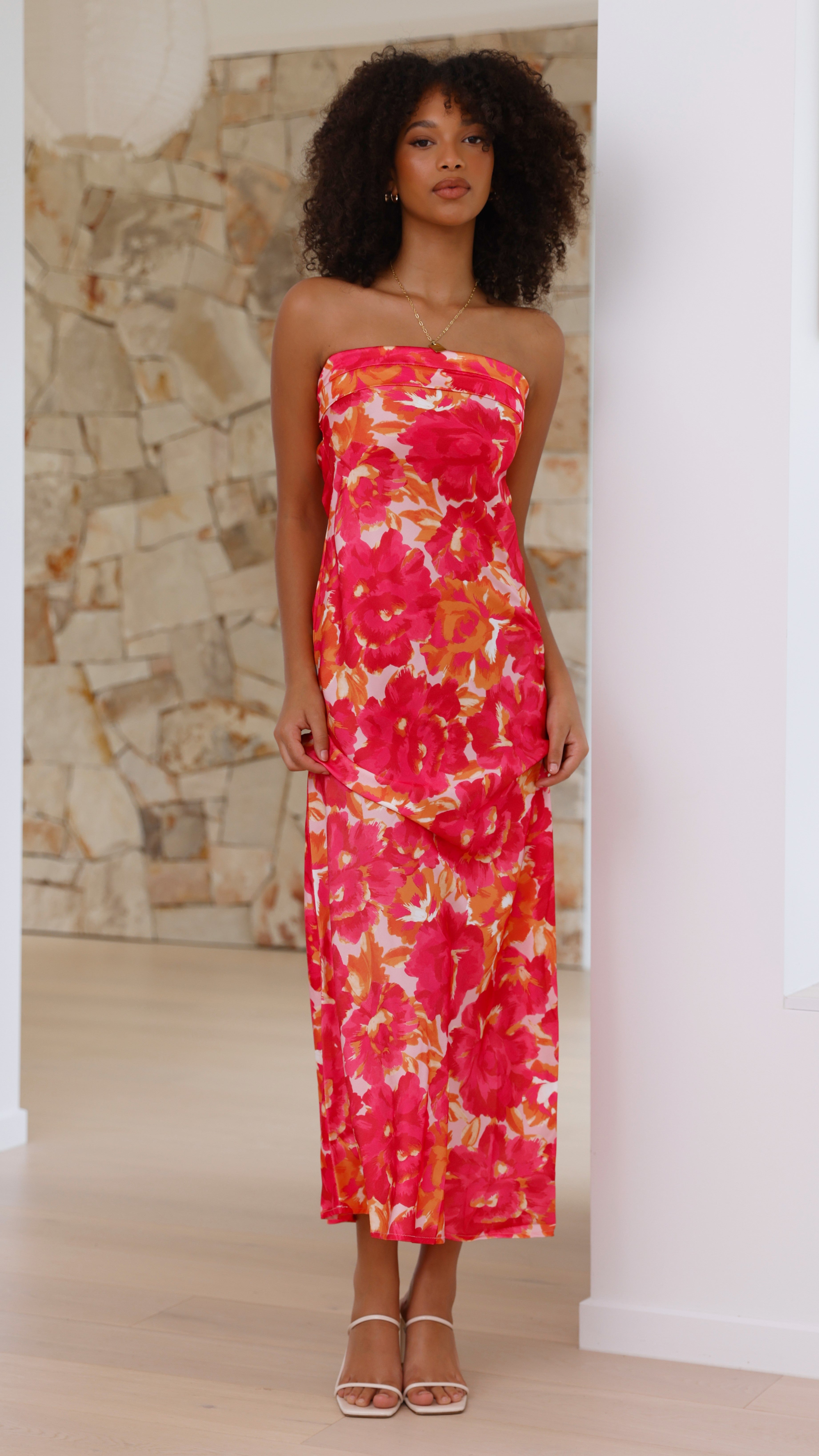 Front view of pink floral strapless midi dress with gathered bodice detail