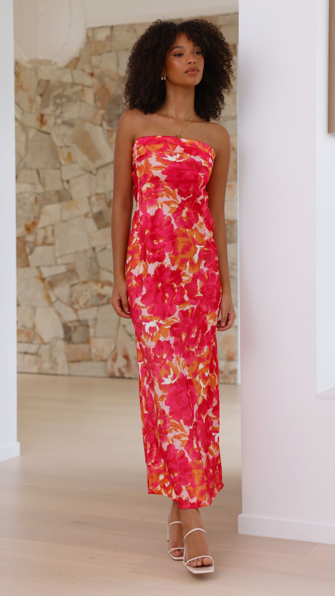 Full length pink floral midi dress with strapless ruched bodice and orange accents