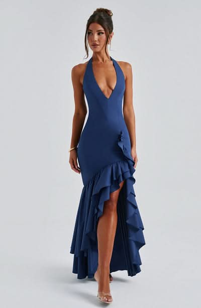 Navy blue halter ruffle maxi dress with cascading ruffles on side