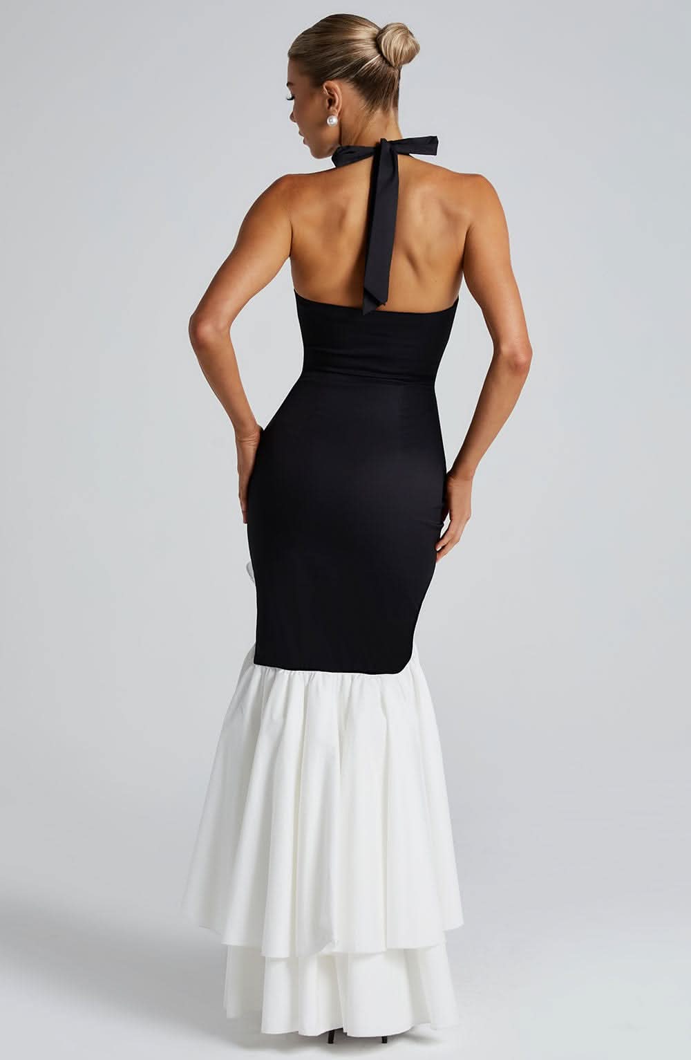 Black and white halter ruffle maxi dress back view with tied halter strap