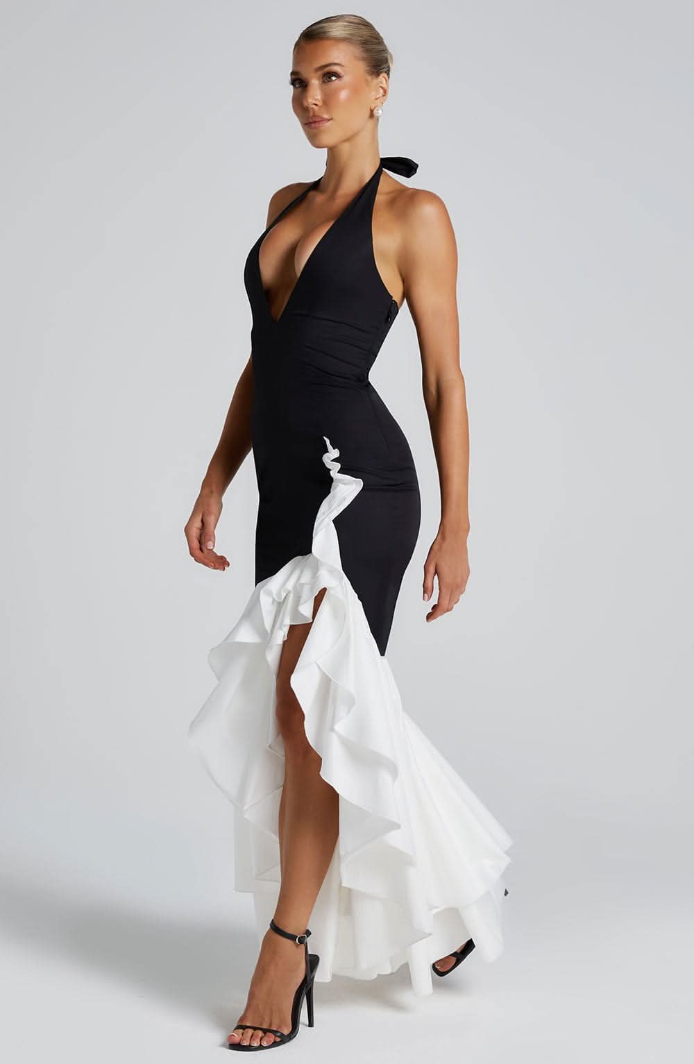 Black and white halter ruffle maxi dress front detail with deep V-neckline