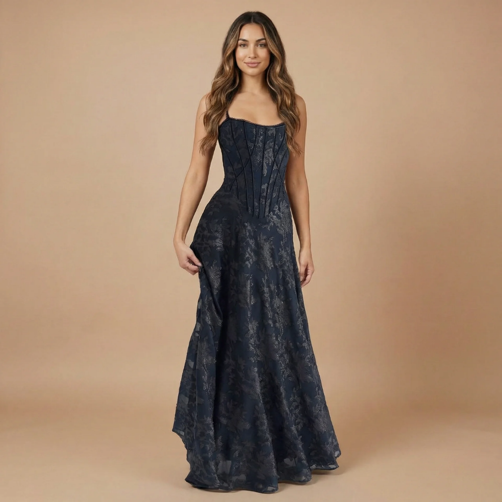 Navy jacquard corset maxi dress with structured bodice and flowing skirt