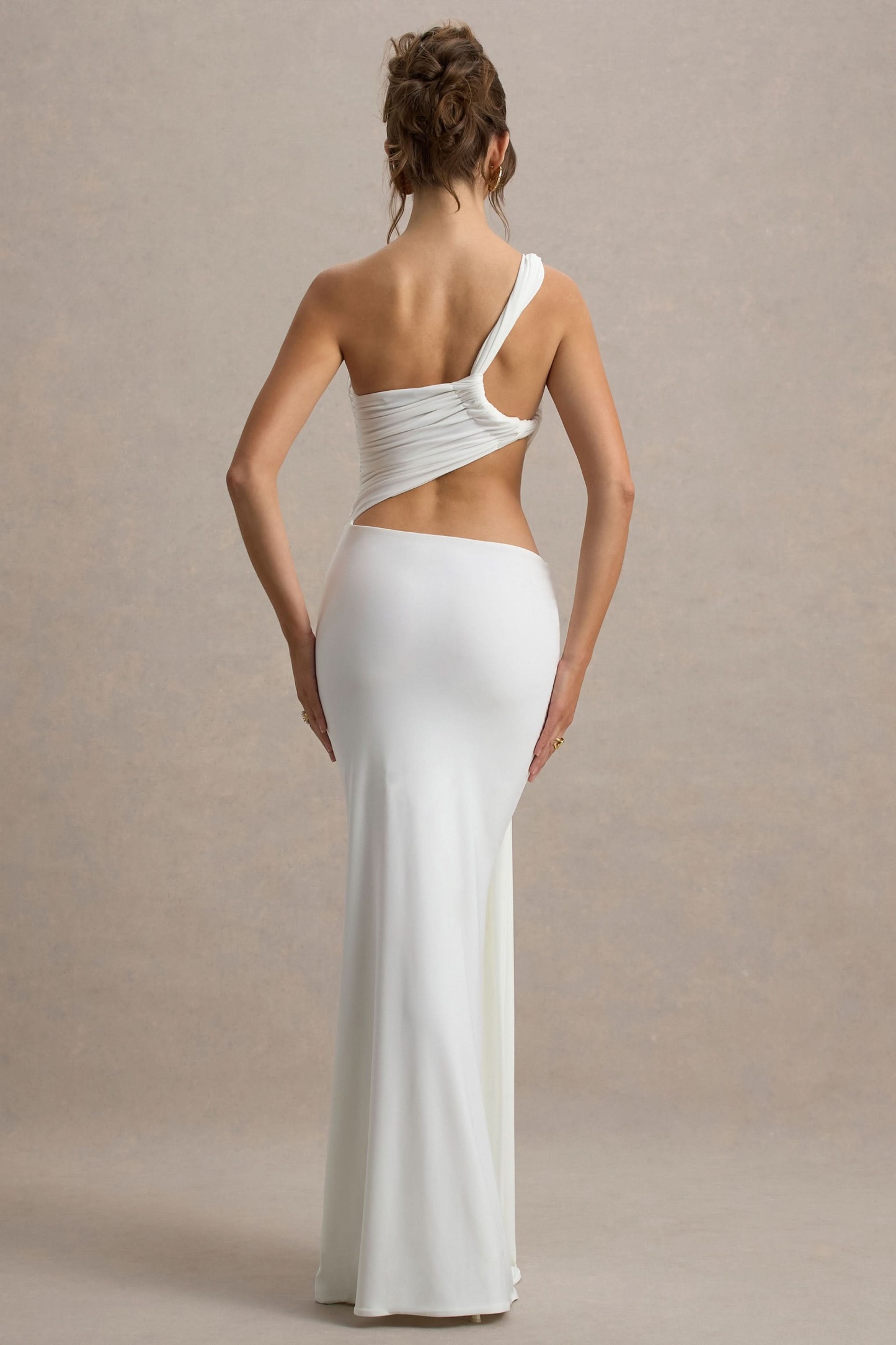 White cutout maxi dress back view with asymmetrical strap design