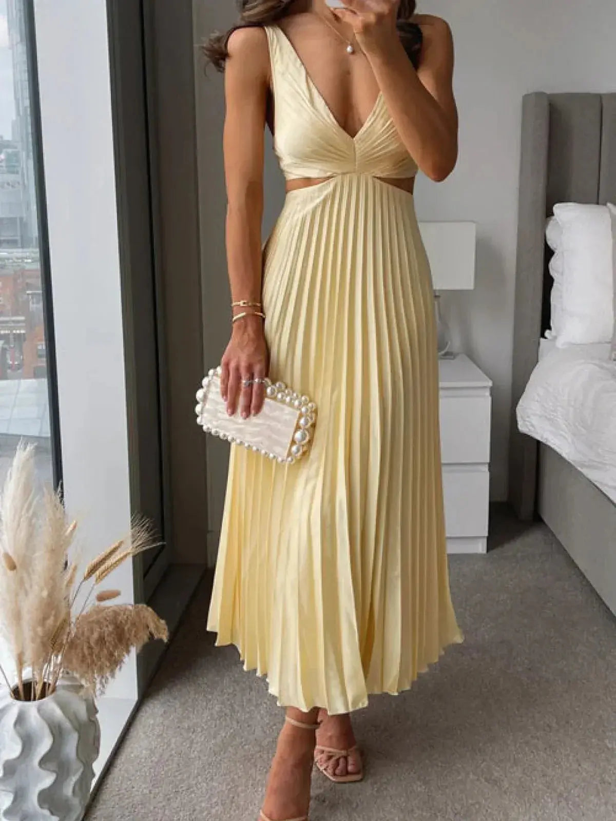 Cream pleated cutout midi dress with V-neck and waist cutout detail