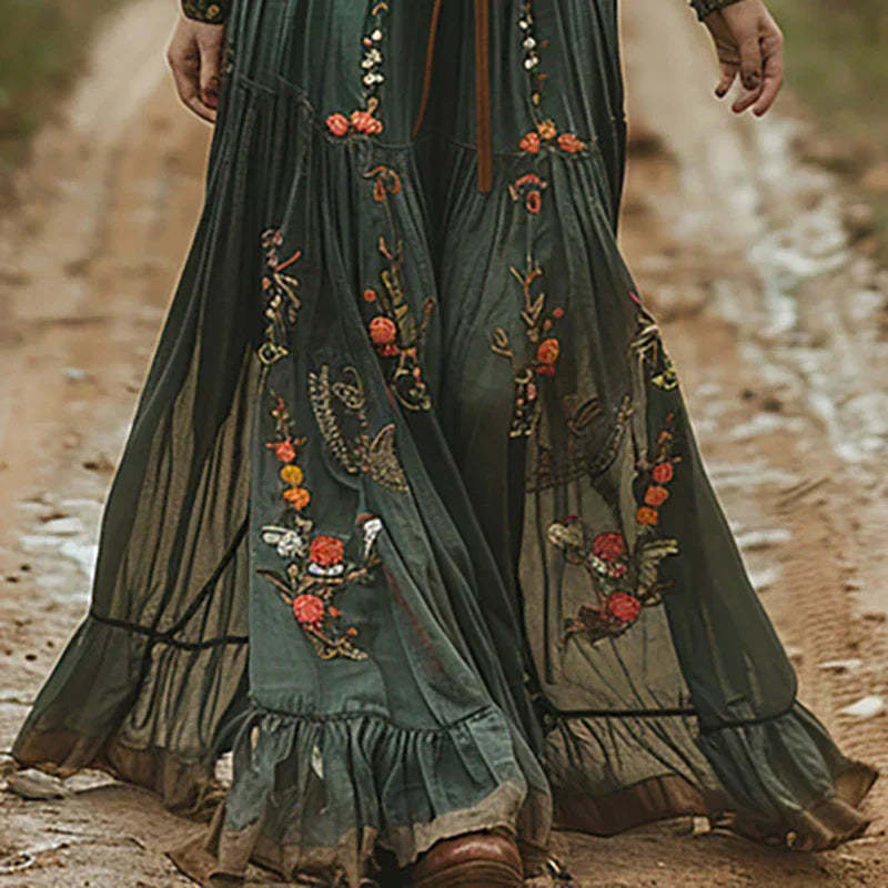 Embroidered floral maxi skirt with tiered ruffled hem and pleated construction