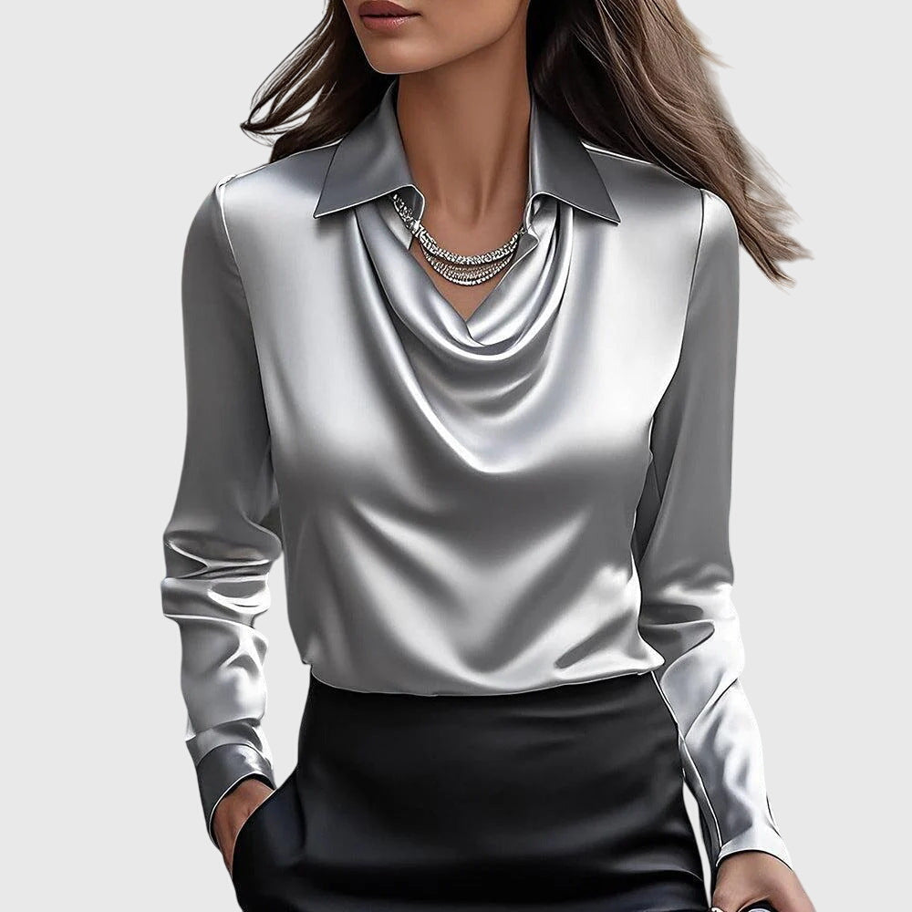 Silver satin draped cowl top with pointed collar and long sleeves