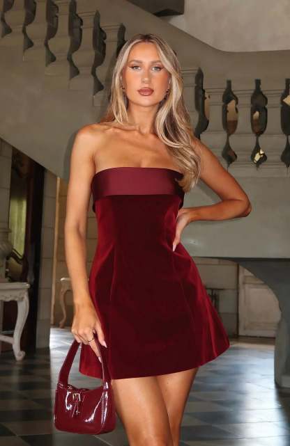 Burgundy velvet bandeau mini dress with fit-and-flare silhouette