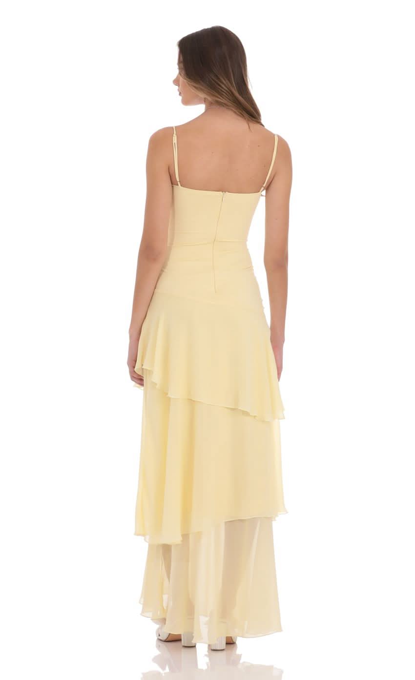 Back view of pale yellow maxi dress showing back zipper and open back design