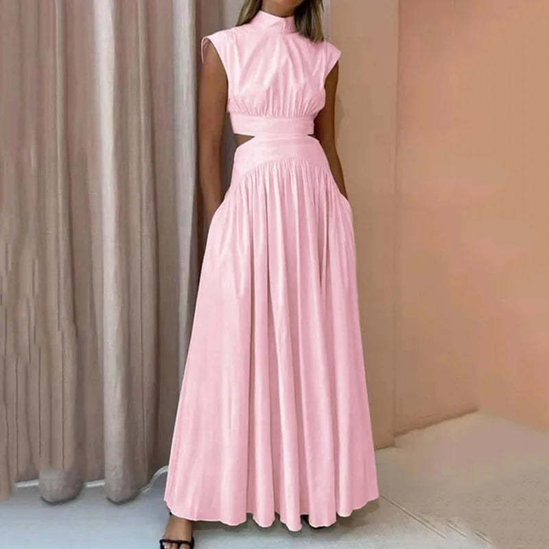 Blush pink formal maxi dress with waist cutouts and elegant silhouette