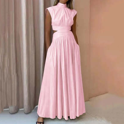 Blush pink formal maxi dress with waist cutouts and elegant silhouette