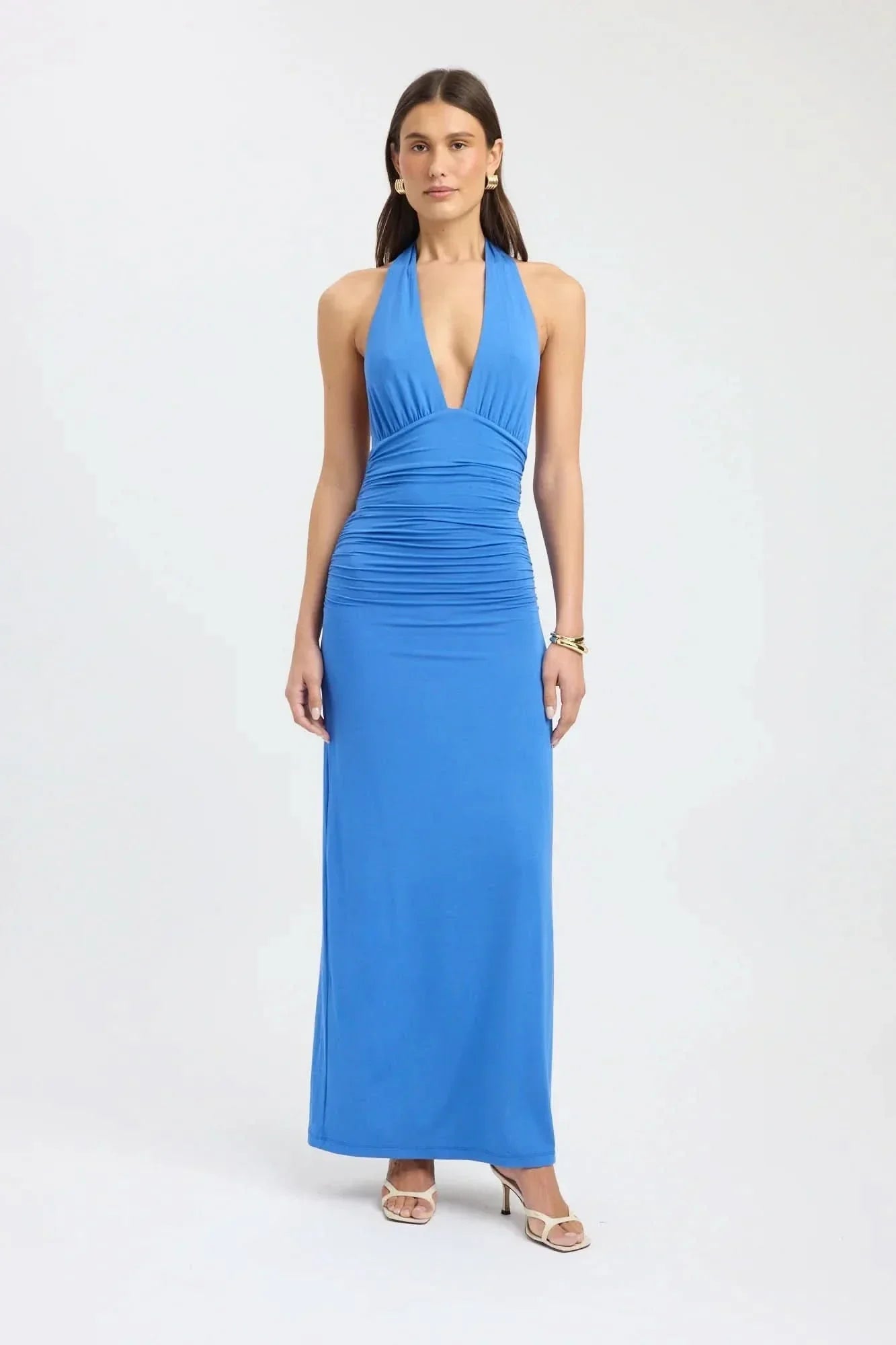 Blue halter maxi dress with deep V-neckline and ruched bodice