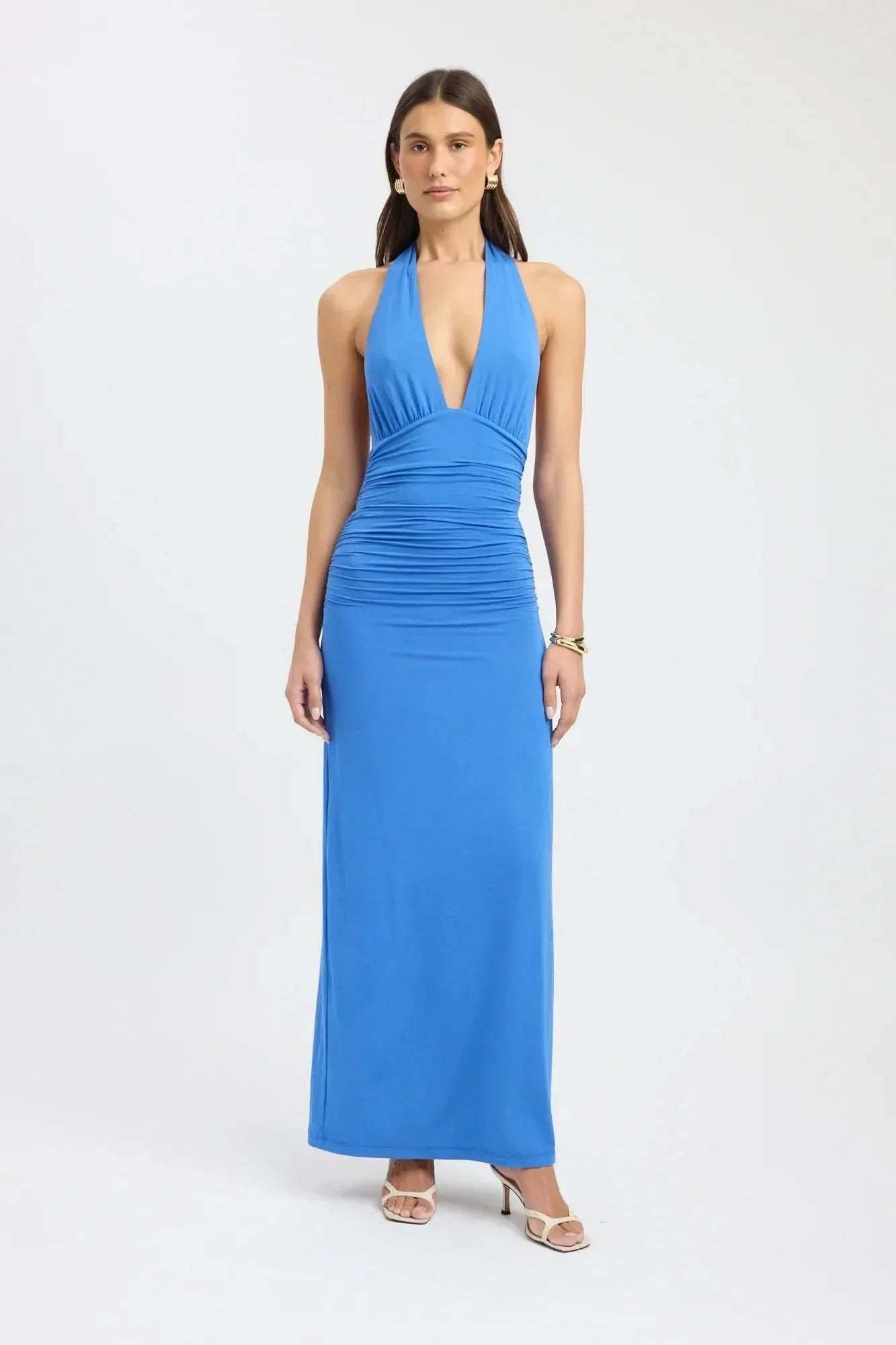 Blue halter maxi dress with deep V-neckline and ruched bodice