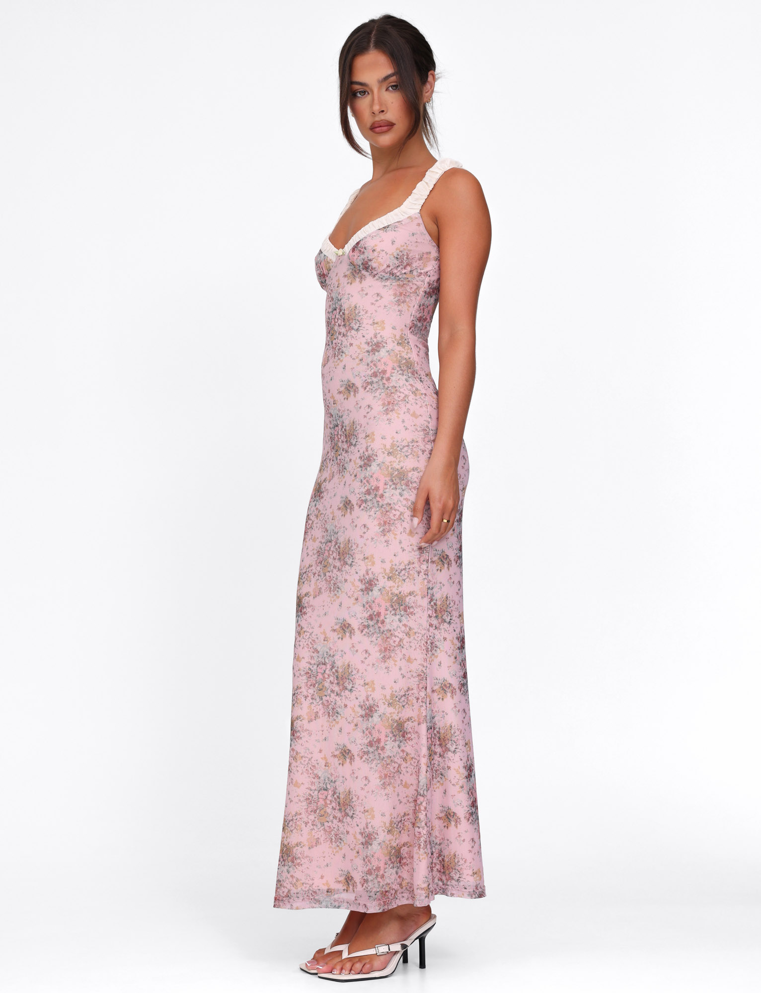 Side view of pink floral maxi dress with ruched fitted bodice