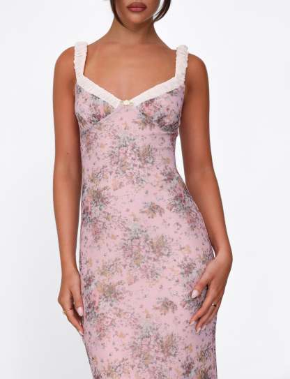 Close-up of sweetheart neckline with white ruched straps on pink floral dress