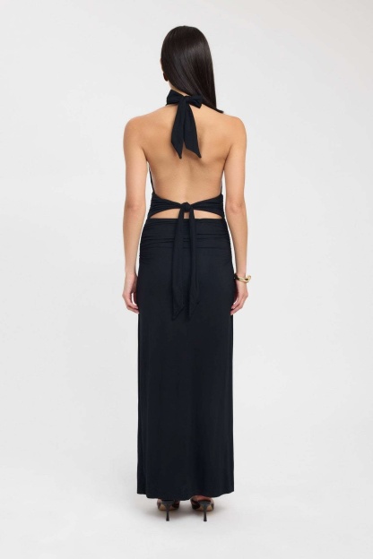 Pale yellow halter maxi dress with ruched waist and deep V-neck