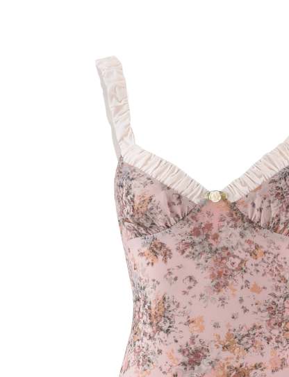 Detail of white ruched strap and sweetheart neckline on pink floral dress