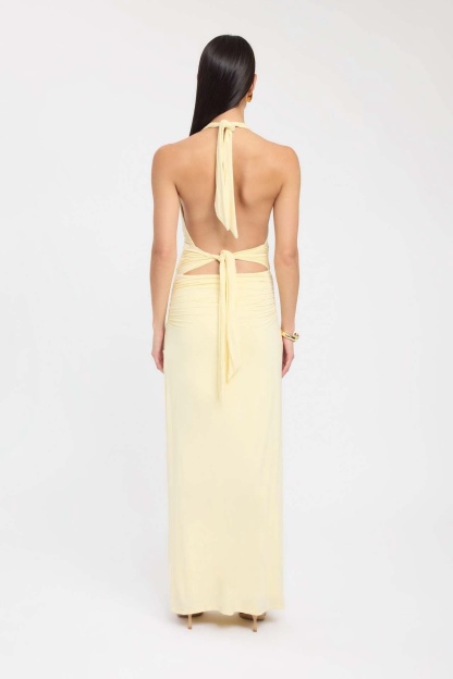 Back view of pale yellow maxi dress with halter tie and open back
