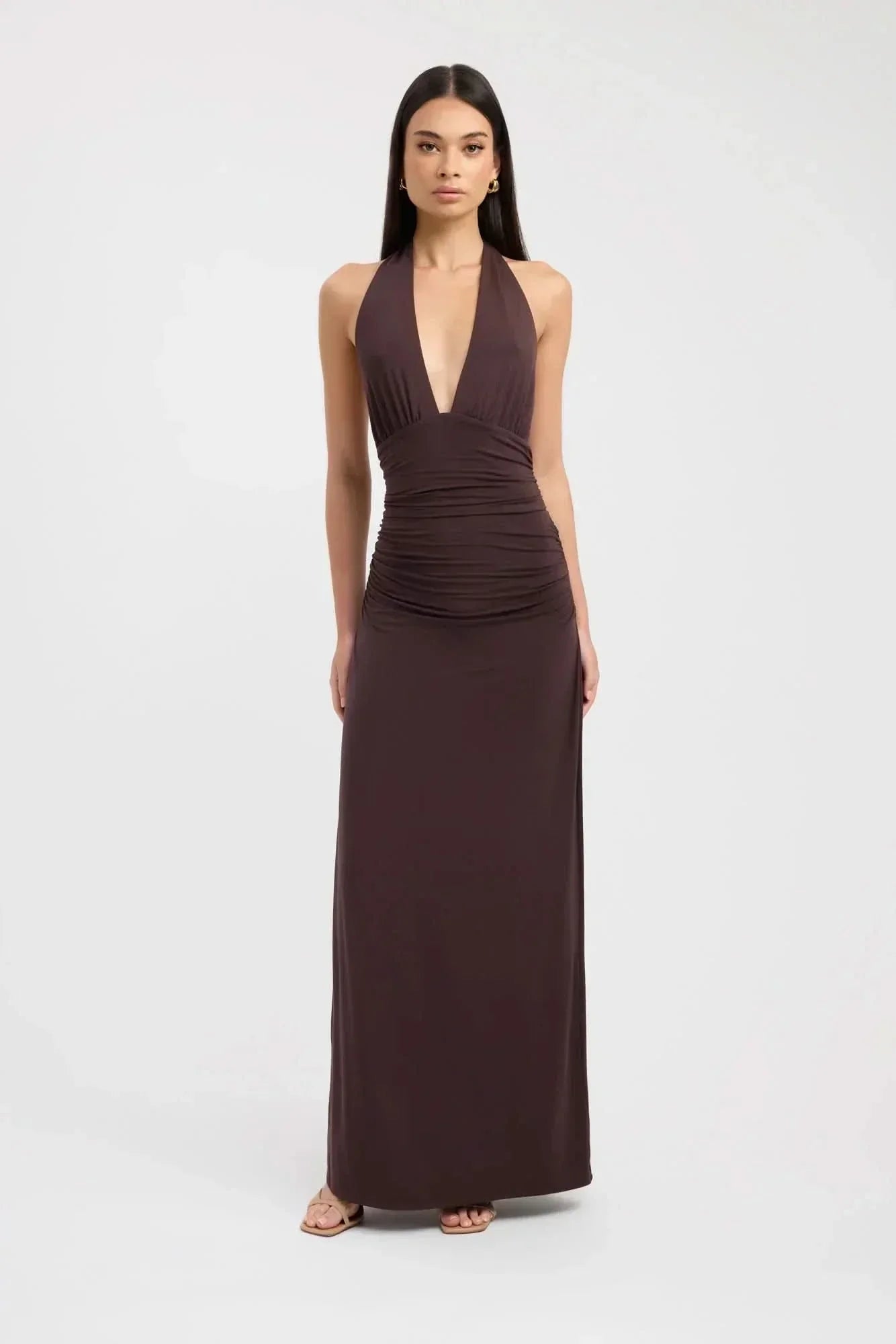 Brown halter maxi dress with deep V-neckline and ruched waist