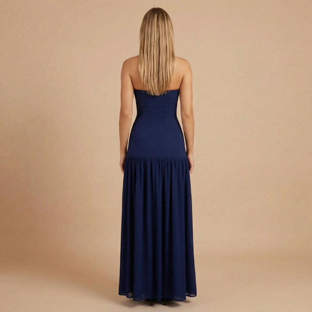 Navy strapless bandeau maxi dress with fitted bodice and flowing skirt, back view