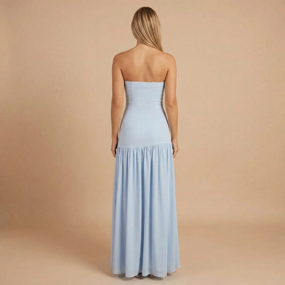 Back view of light blue bandeau maxi dress with flowing skirt