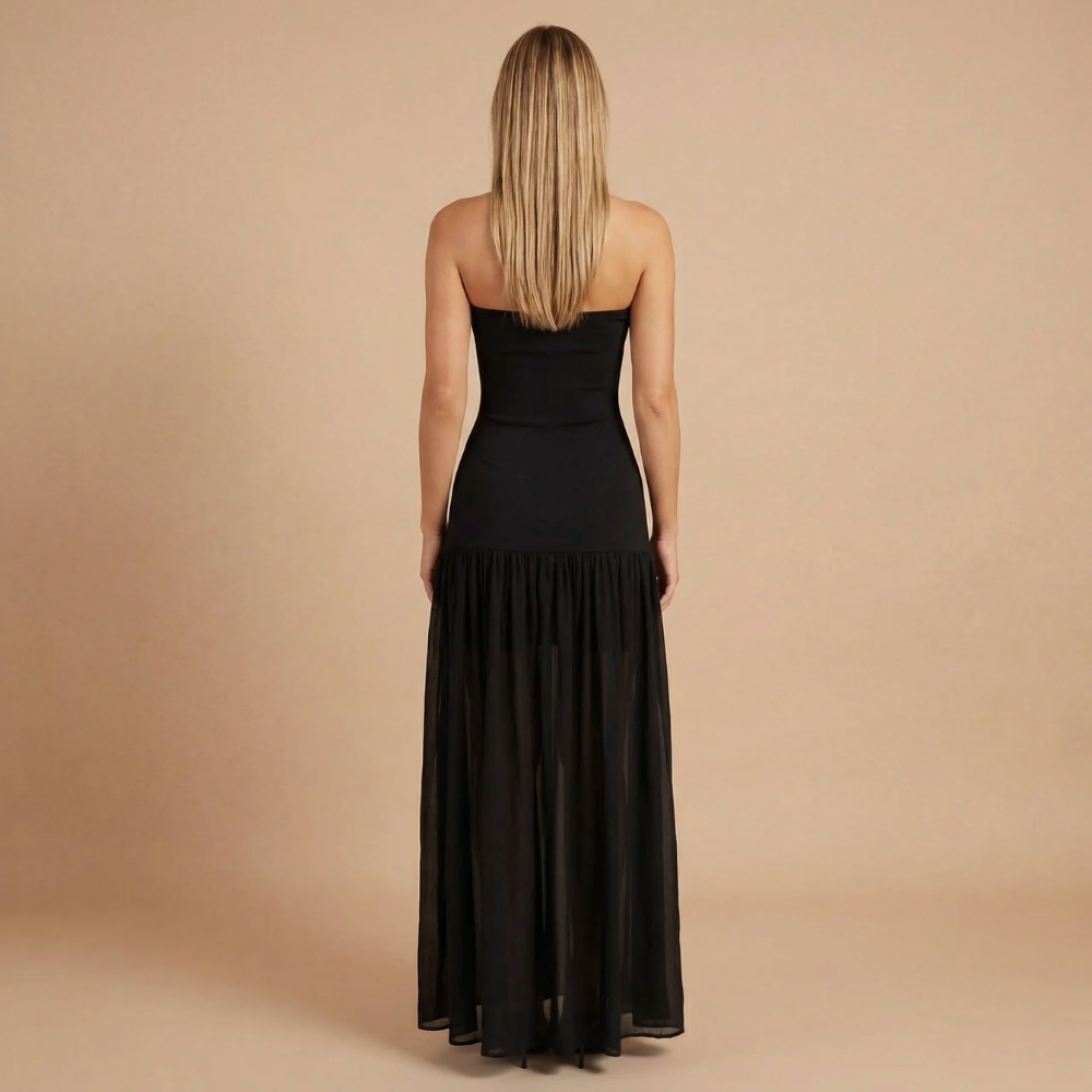 Back view of black bandeau maxi dress with draped skirt