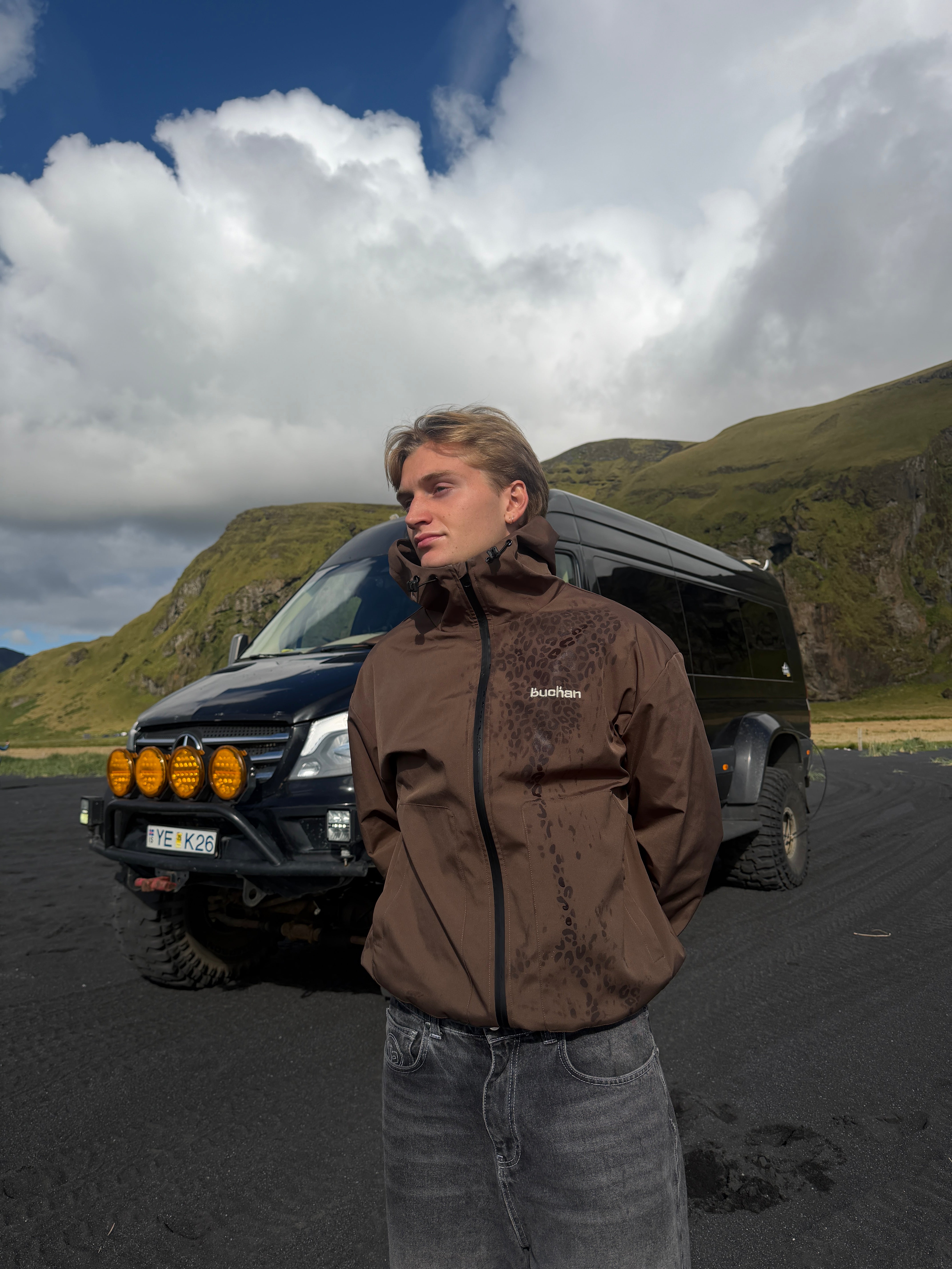 Water Reactive Cheetah Rain Jacket - Brown — source media 3