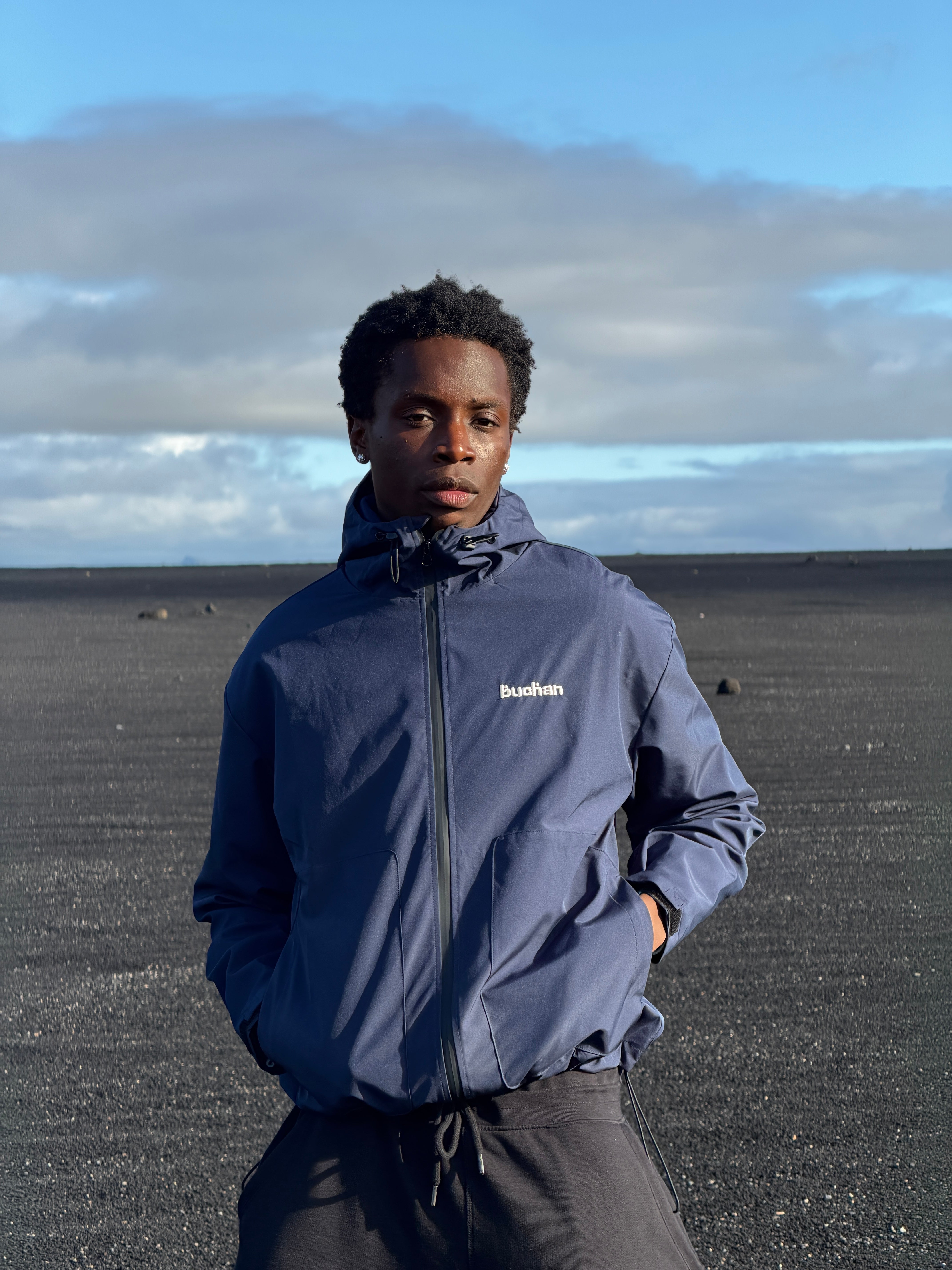 Water Reactive Cheetah Rain Jacket - Navy — source media 4