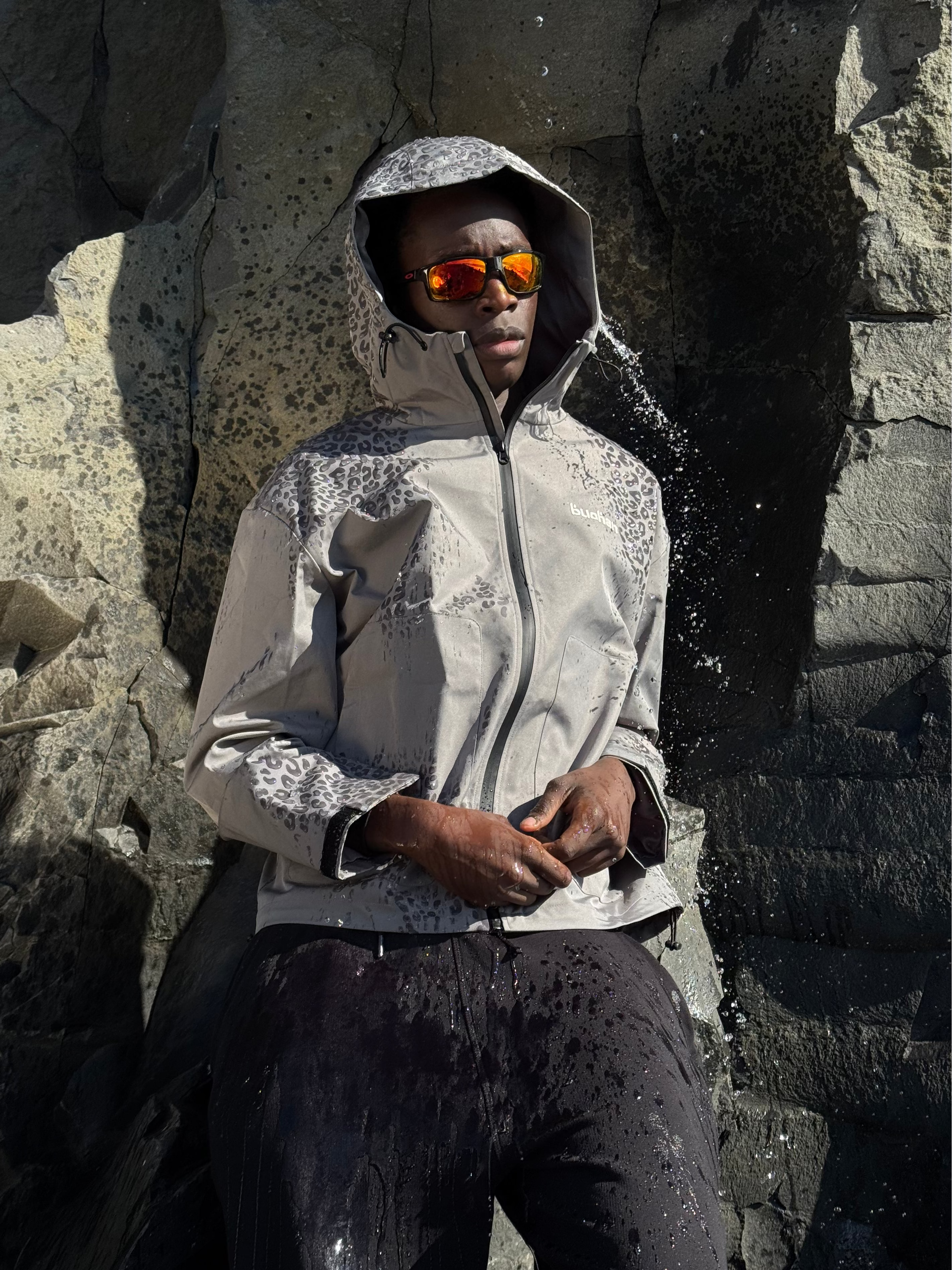 Water Reactive Cheetah Rain Jacket - Grey — source media 2