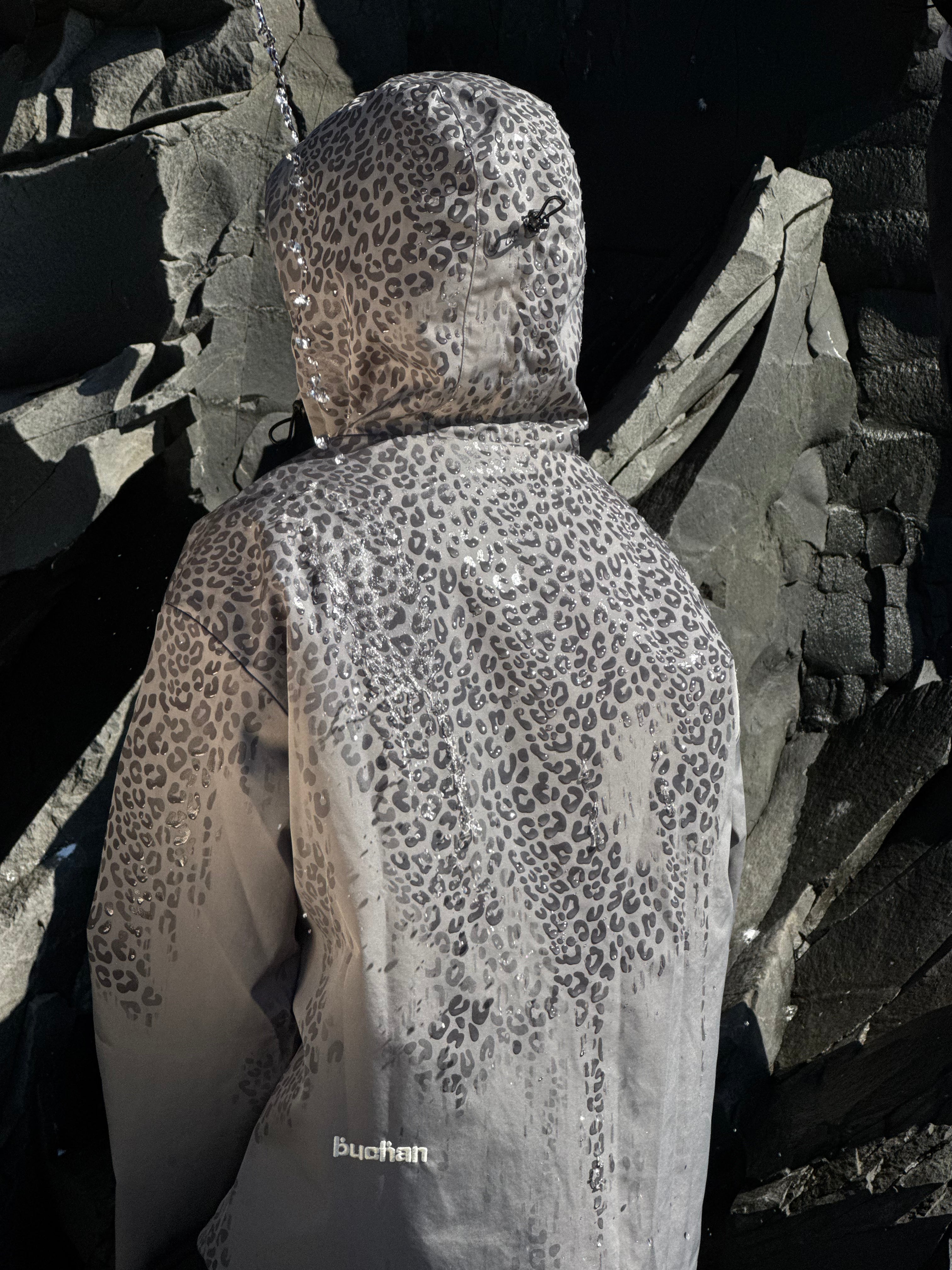 Water Reactive Cheetah Rain Jacket - Grey — source media 4