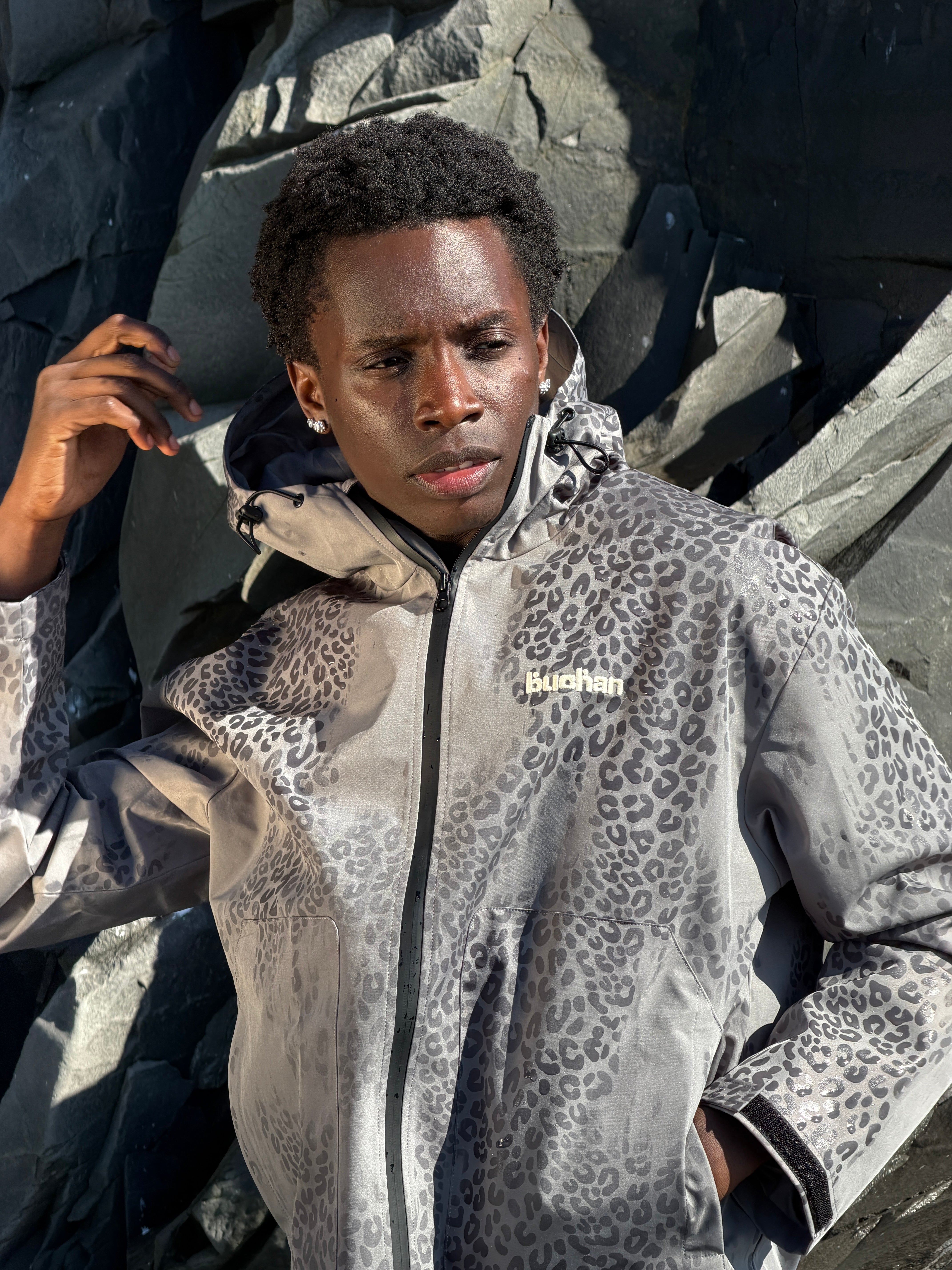 Water Reactive Cheetah Rain Jacket - Grey — source media 5