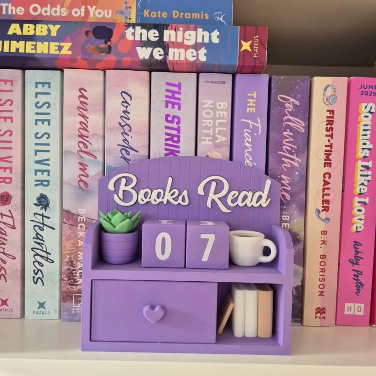 Books read tracker displayed in a cozy reading space