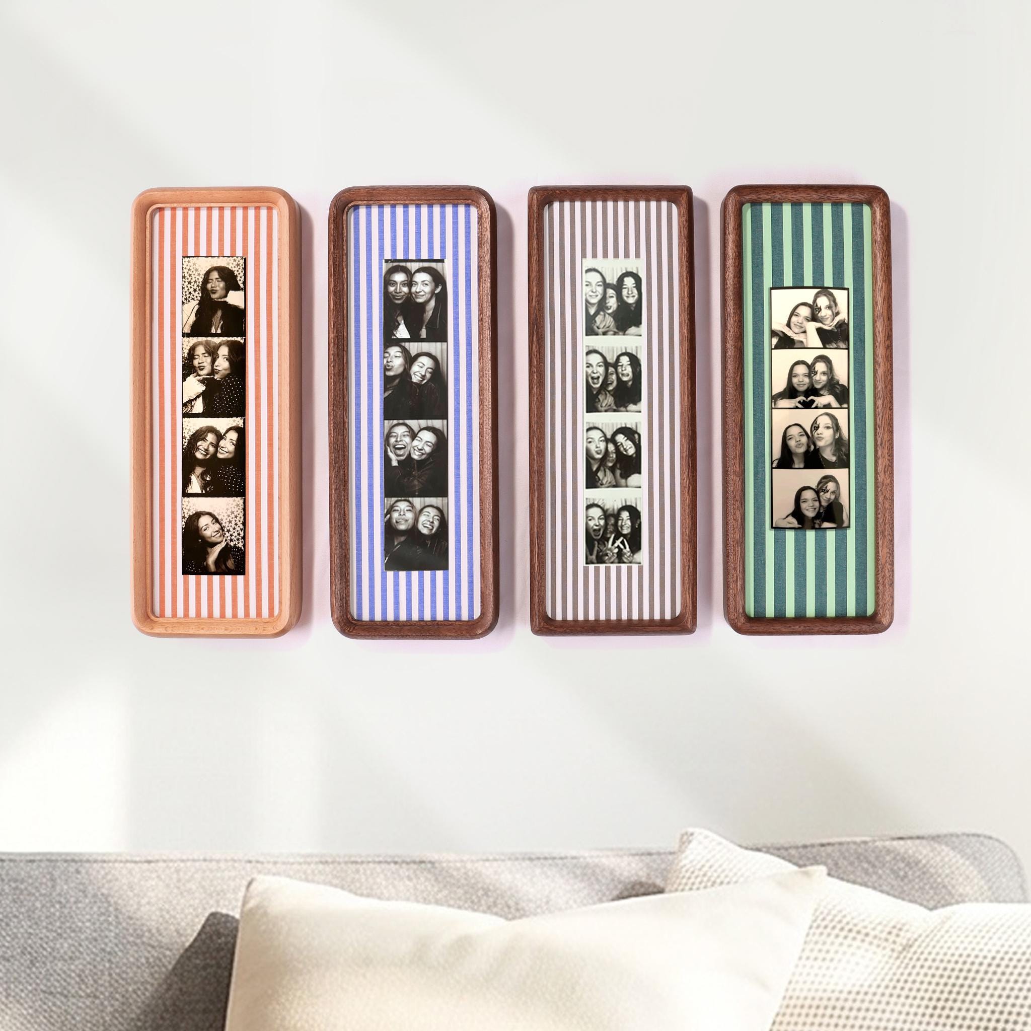 Photo booth strip frame displayed in a home setting