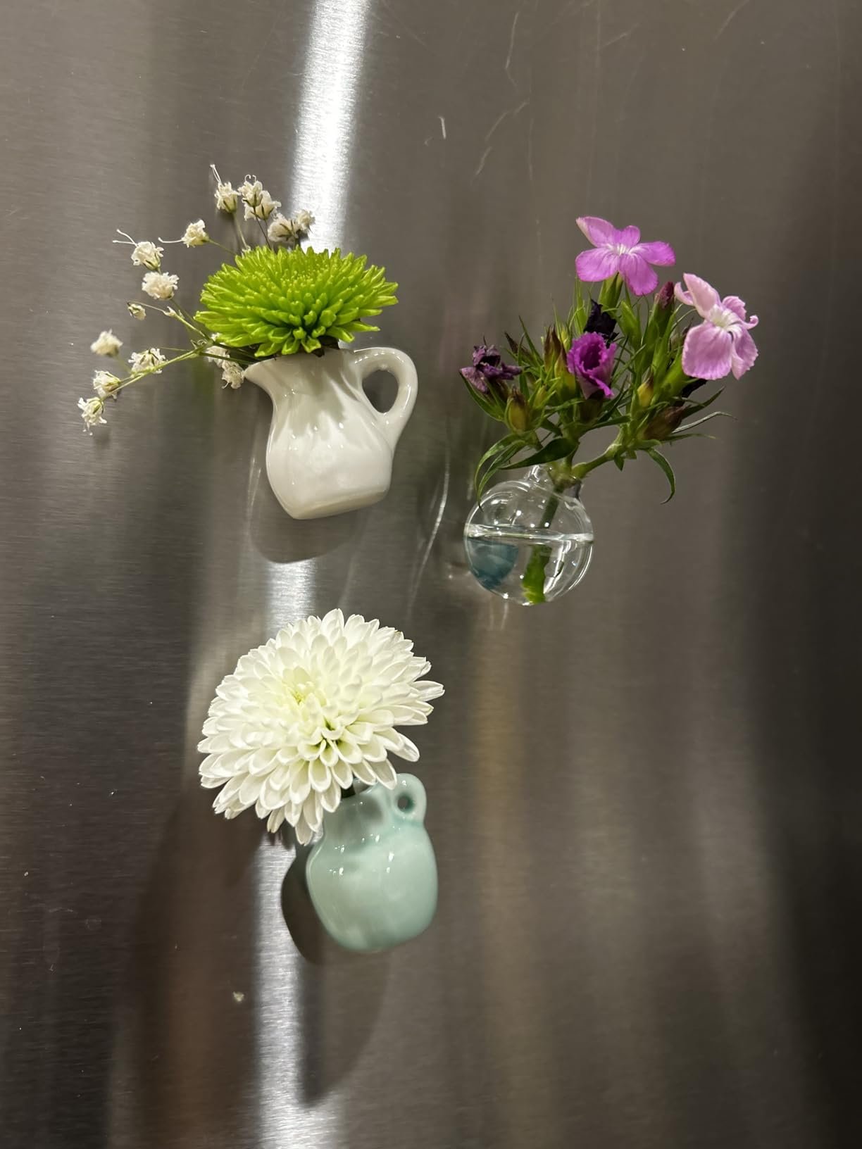 Magnets are strong, and little fake flowers are also included if you don’t want the real ones