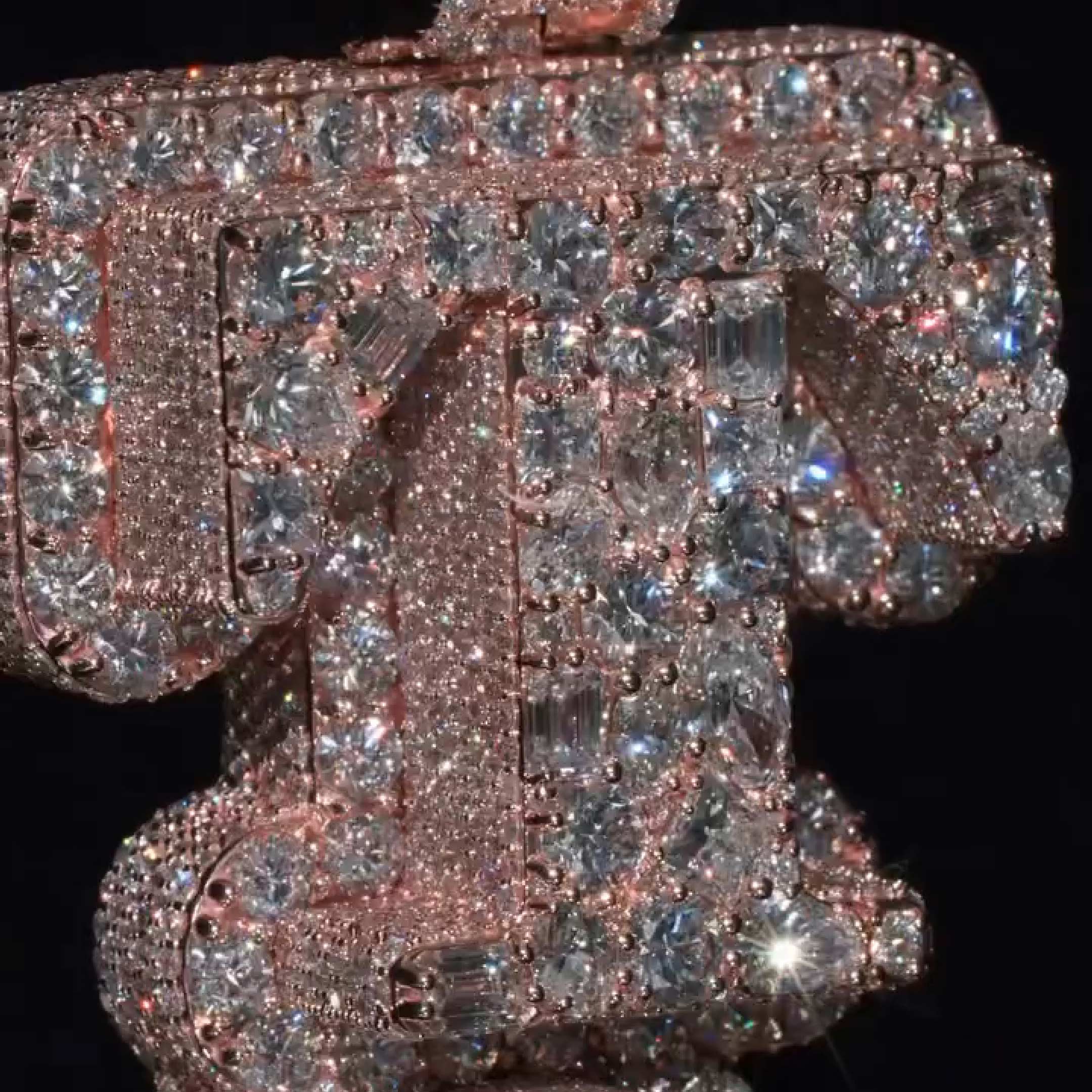 close up T and J pendant stone details