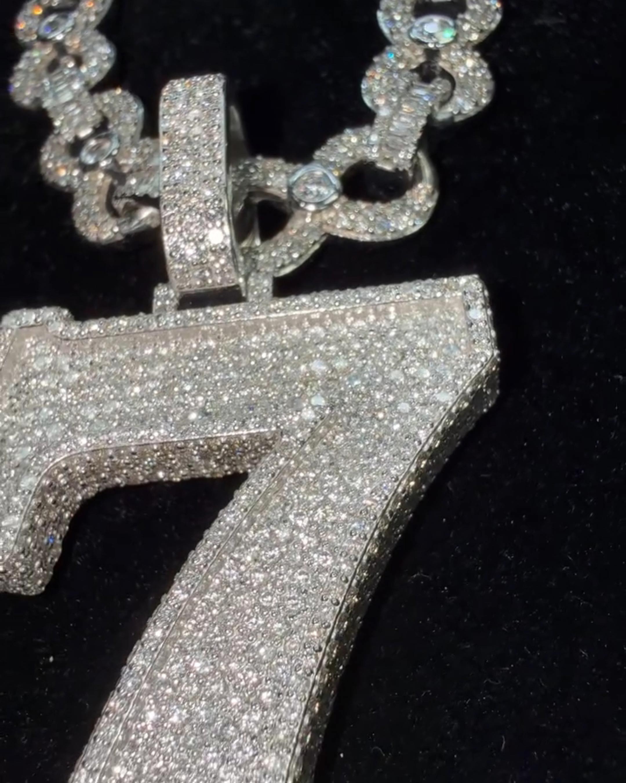 close up 7 pendant iced out stone details