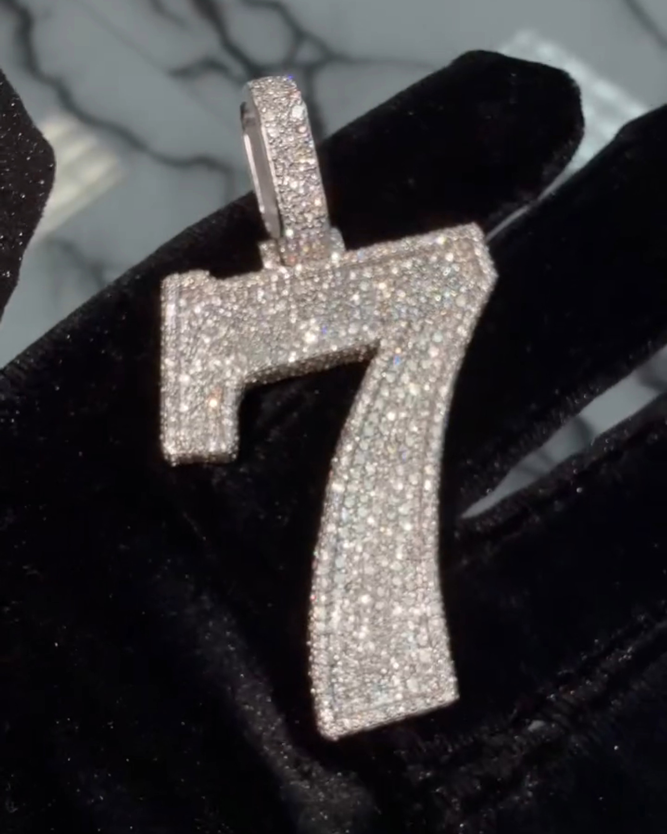 model wearing 7 number pendant layered chains