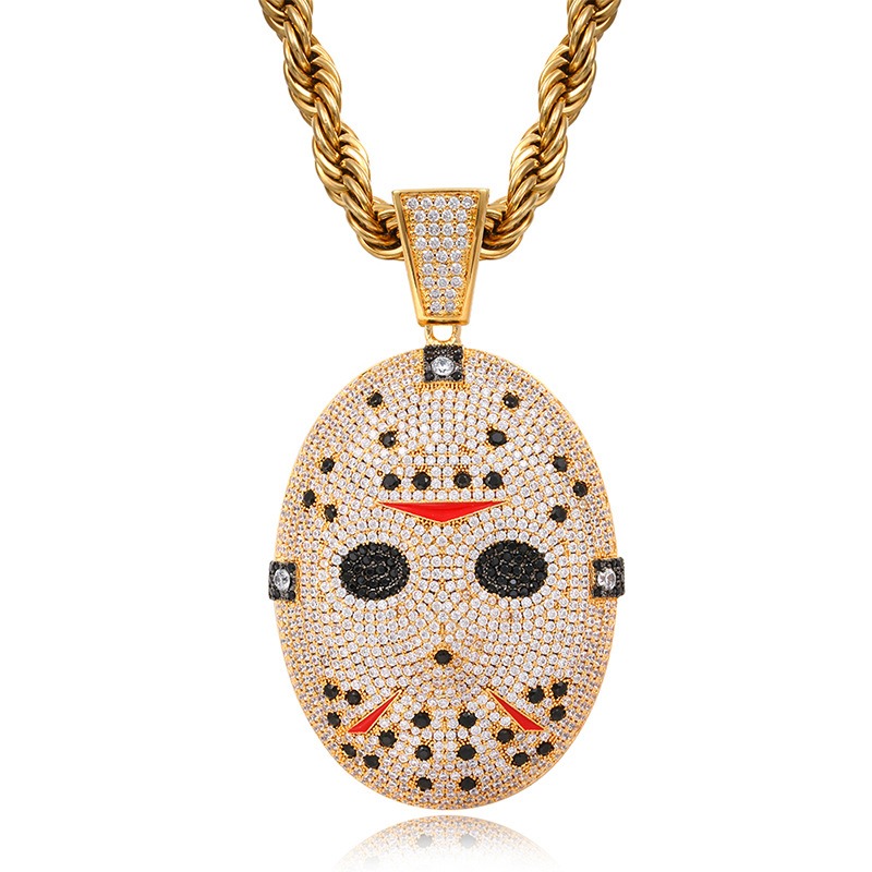 gold horror puppet style pendant close up craftsmanship detail luxury finish