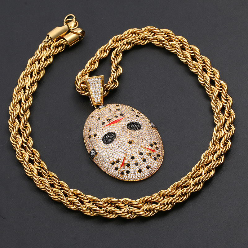 gold horror puppet style pendant angled view premium jewelry design
