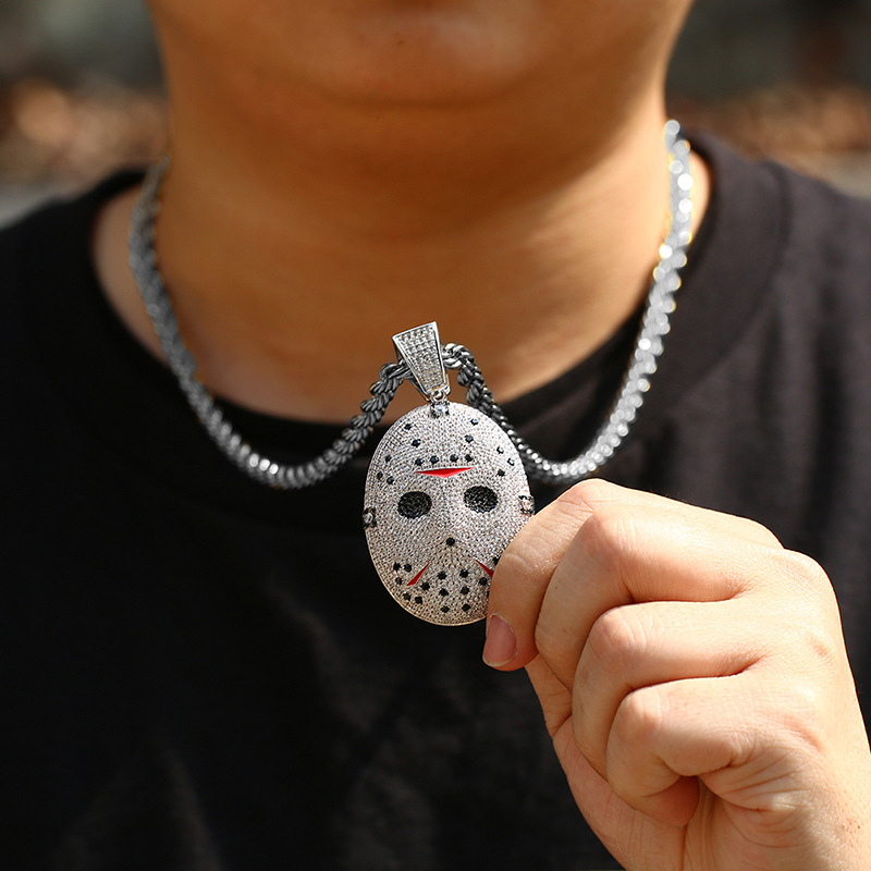 model wearing white gold horror puppet style pendant luxury streetwear style